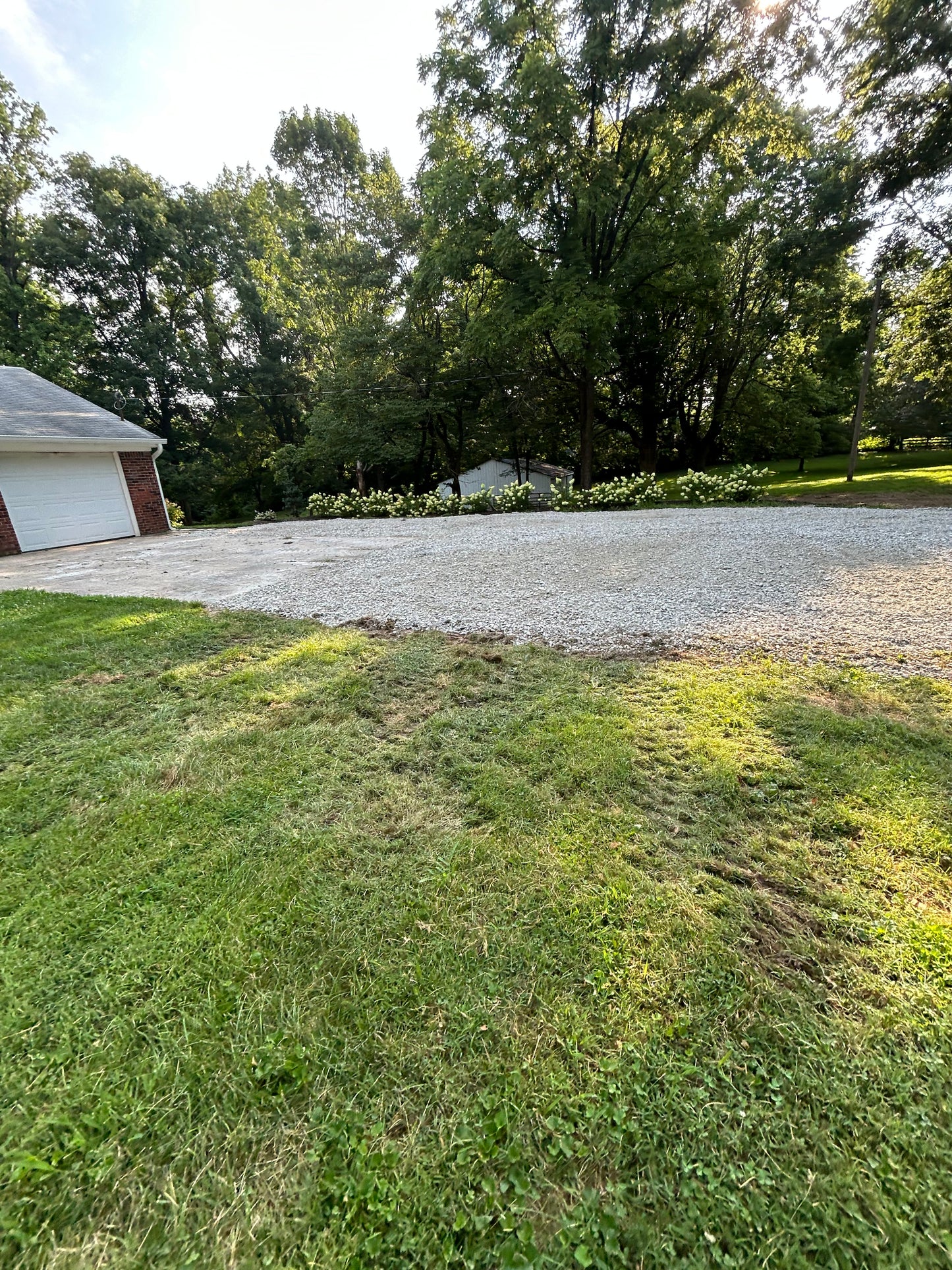 Gravel driveway with grass