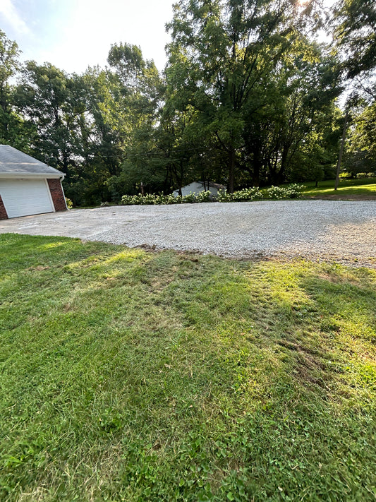 Gravel driveway with grass